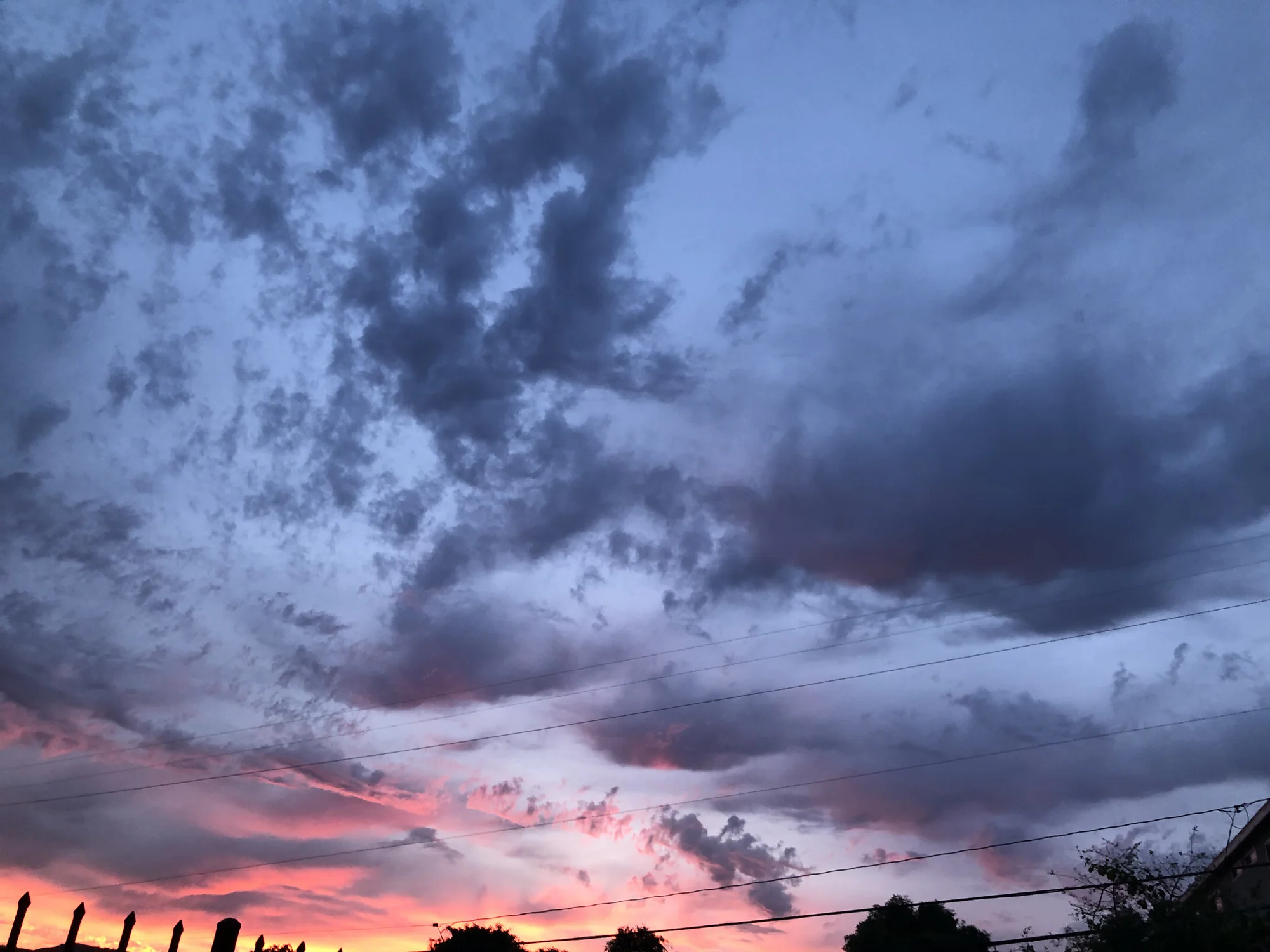 Storm clouds illuminated with magenta light